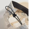 A close-up view of a light gray breathable quick-dry baseball cap with a black adjustable strap.