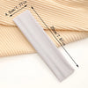 A gray stretchable cotton sweat absorbing headband is shown rolled out on a beige ribbed fabric.