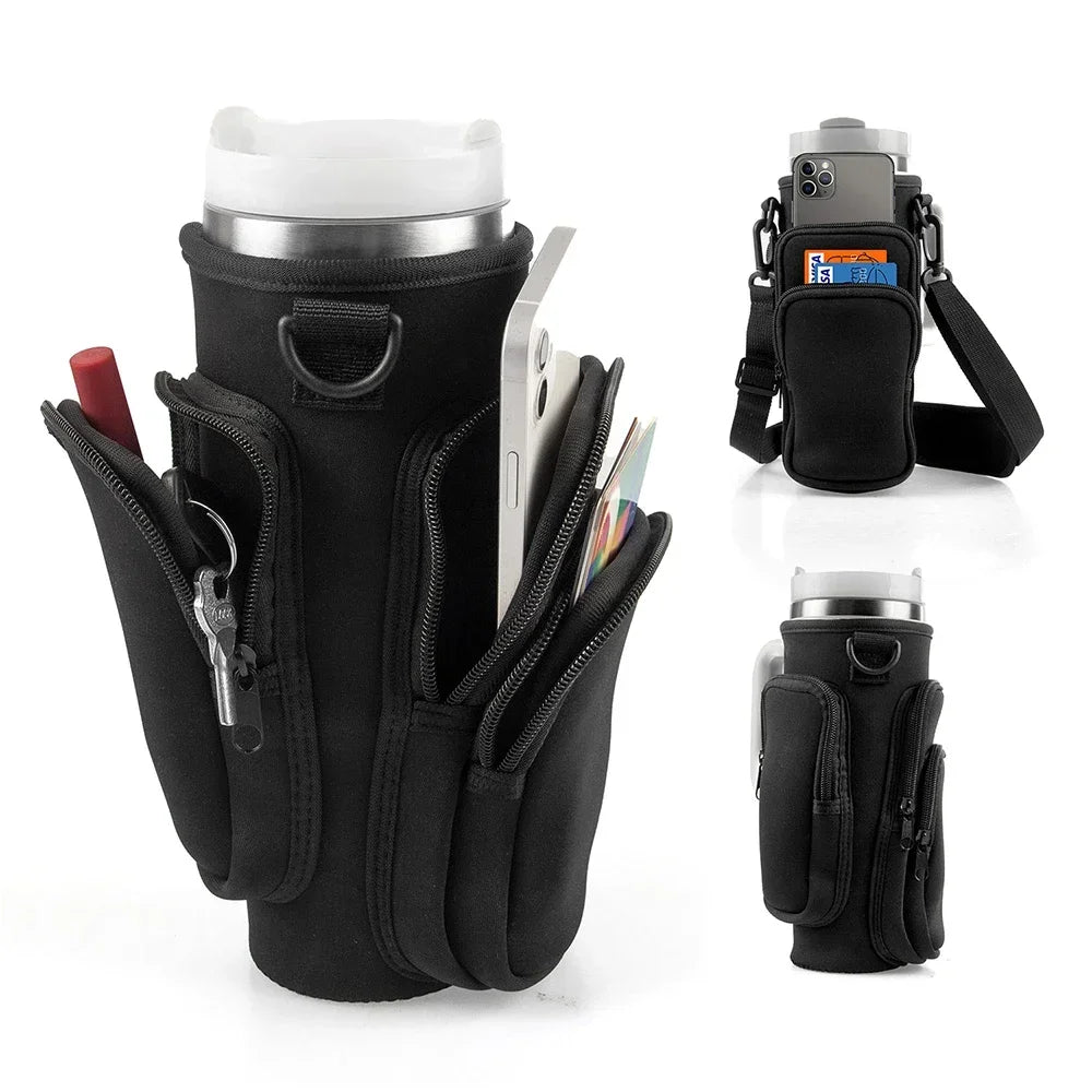 Black versatile water bottle carrier bag holding a tumbler and various accessories.