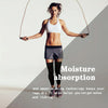 A woman demonstrates moisture absorption and sweat-wicking technology with compression leg sleeves.