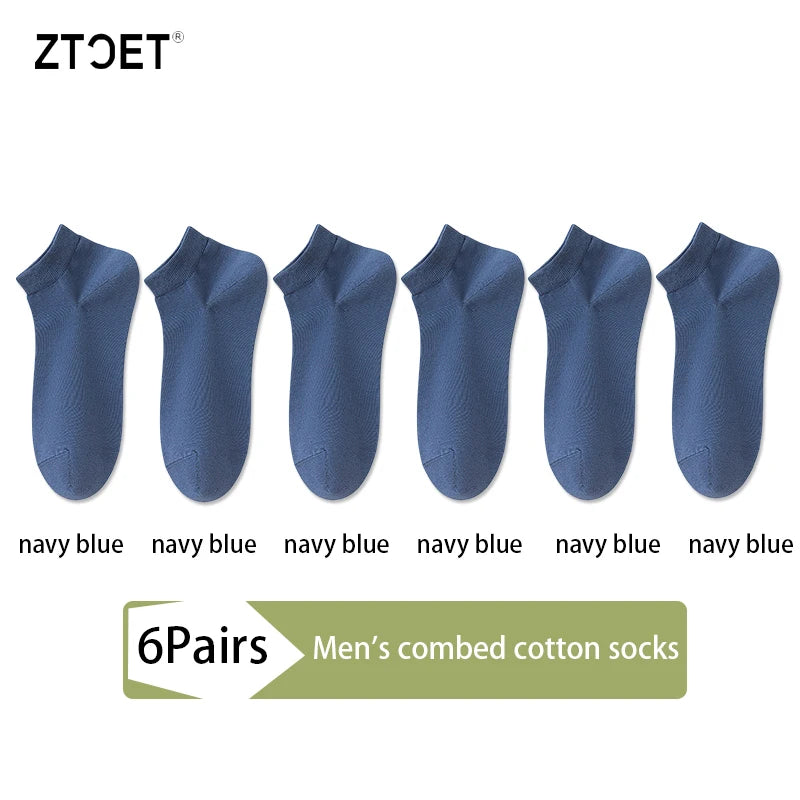A set of six navy blue men's combed cotton socks displayed individually.