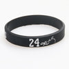 Black silicone wristband with the number 24 and a signature on the front
