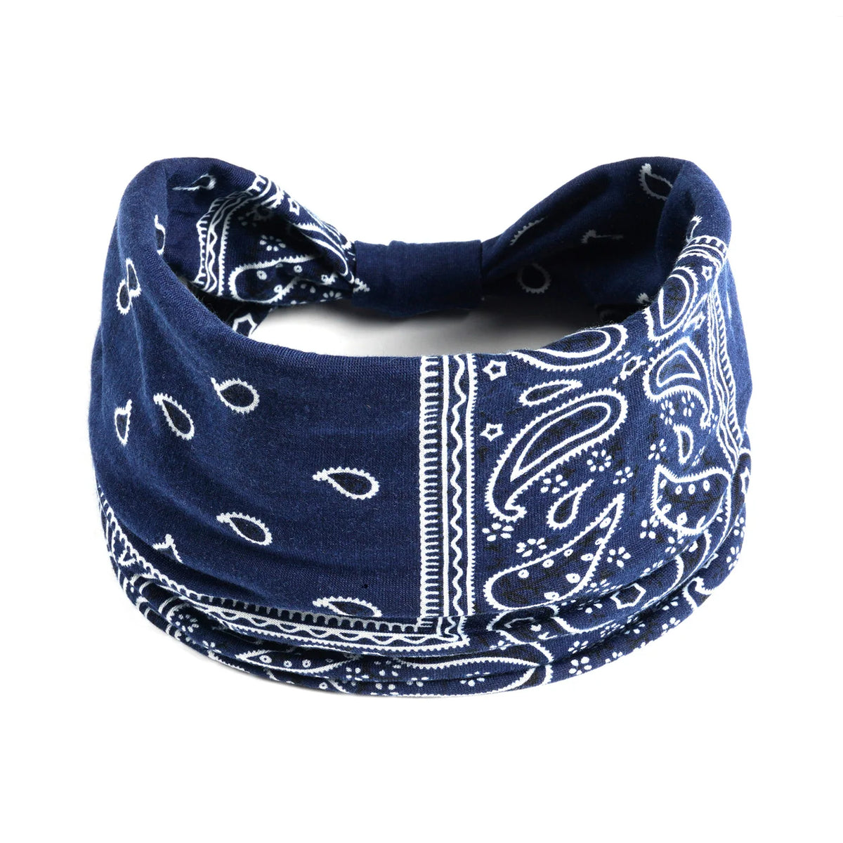 A navy blue bohemian cotton stretch headband with white paisley and geometric patterns.