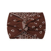 A dark brown boho printed wide knotted headband with white paisley and floral patterns.