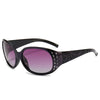 Black polarized sunglasses with purple lenses and diamond-inlaid detailing