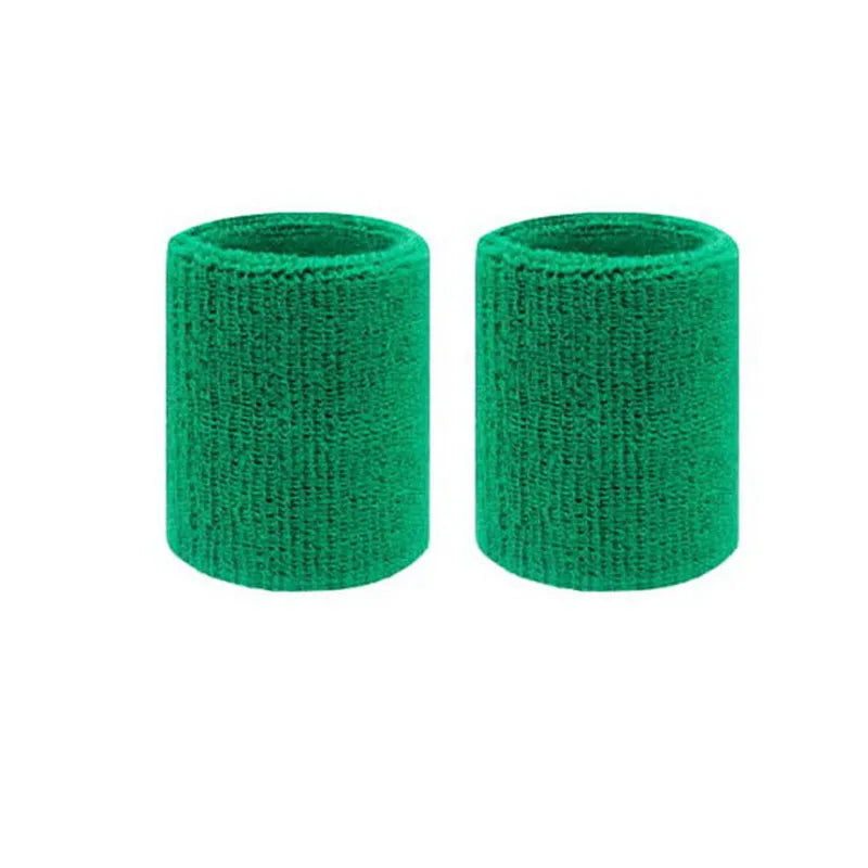 Pair of green dual sports wristbands for sweat absorption