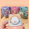 A close-up of a light orange cartoon animal water bottle with a white lid and pink accents.