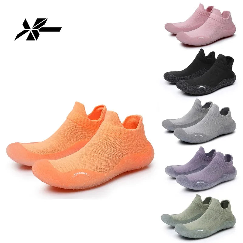 A collection of summer quick-dry slip-on shoes in various shades of pink, black, gray, and orange.