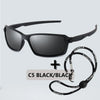 Black sports sunglasses with a black strap shown against a light gray background.