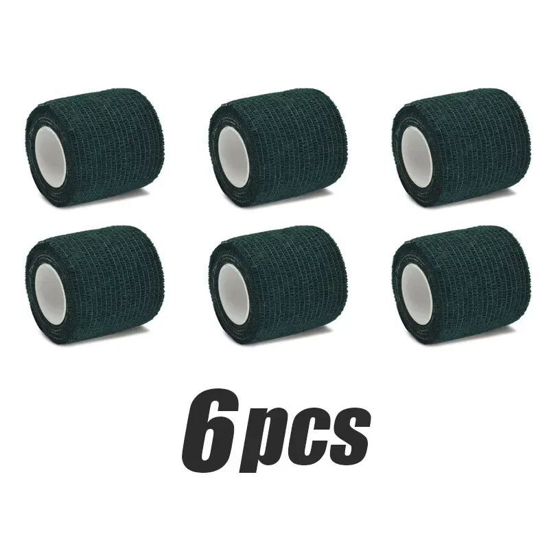 Six rolls of dark green elastic tattoo grip tape for finger and wrist protection.