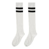 A pair of white cotton knee high socks with black horizontal stripes.
