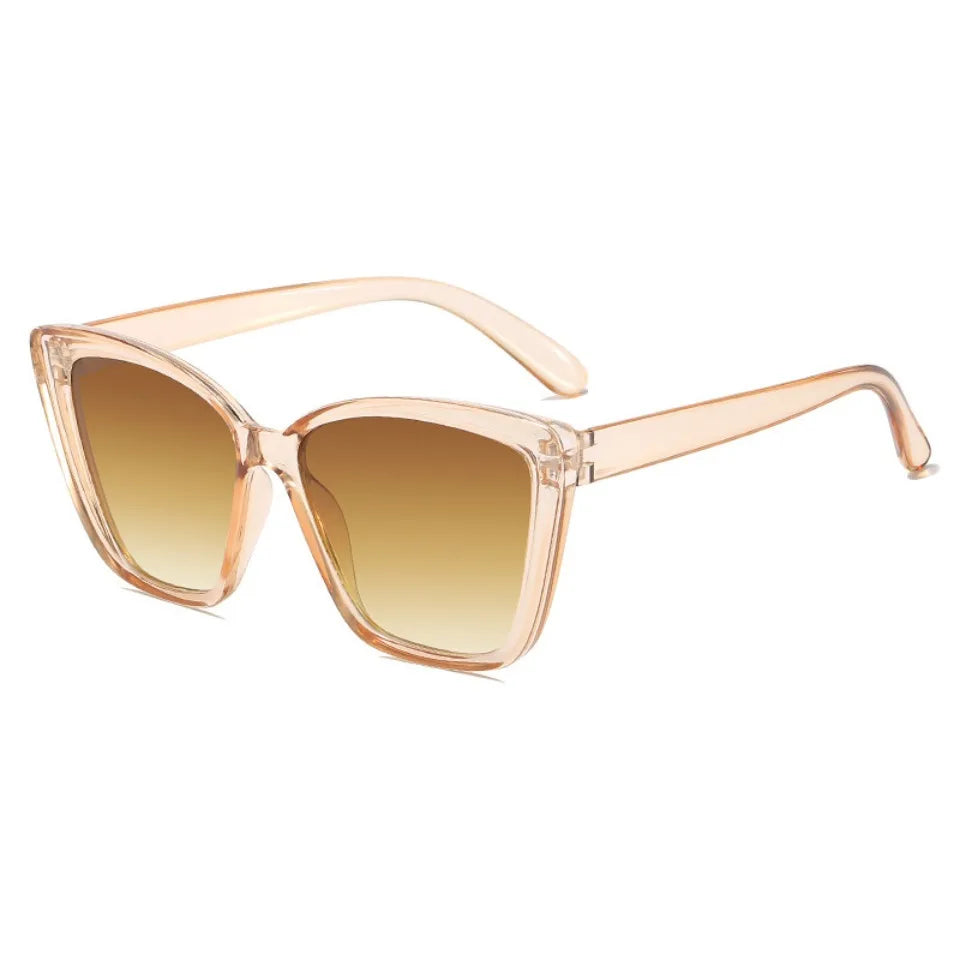 Peach-toned cat eye vintage sunglasses with gradient lenses