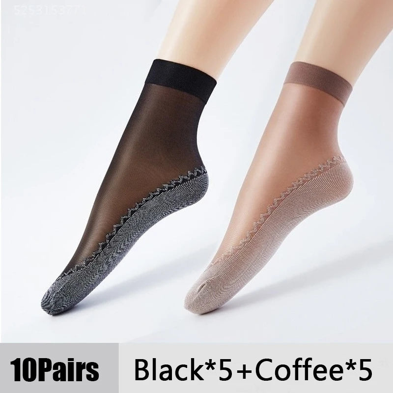 A pair of black and coffee colored ultra-thin breathable ankle socks shown on a foot.