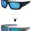 A pair of black vintage rectangle sunglasses with blue lenses and a grey/green option shown in different views.