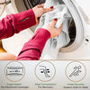 Hands are placing a gray elastic compression bandage on a person's arm inside a washing machine drum.