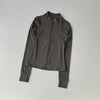 A dark gray long-sleeved zip-up jacket for yoga and fitness.
