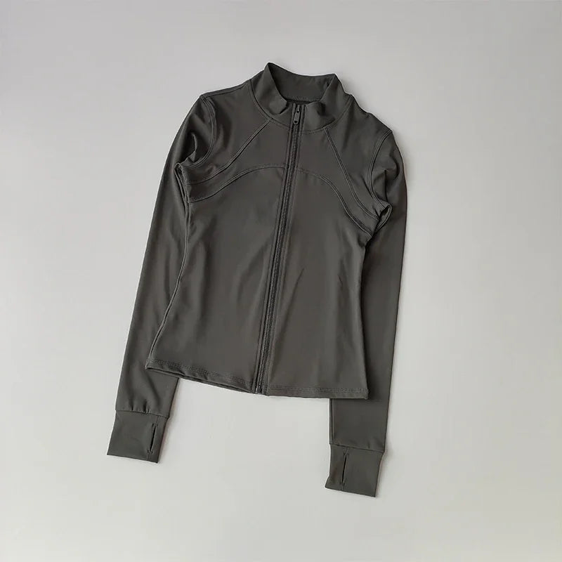 A dark gray long-sleeved zip-up jacket for yoga and fitness.