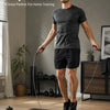 A man performing a daily workout with an adjustable weighted speed jump rope on a black mat.