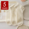Five pairs of cream colored breathable mesh lace tube socks displayed on a white surface.