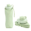 A light green silicone folding water bottle with a screw cap, shown standing and folded.