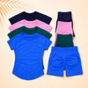 A stack of seamless high-waist yoga set tops and bottoms in various shades of pink, green, and blue.
