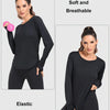 A woman models a black, long-sleeved, elastic fabric top and matching leggings for sun protection.