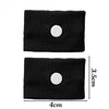 Black knitted wristband with a white button for anti-nausea relief