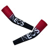 A pair of red and black cycling arm warmers with the brand name INEOS printed on them.
