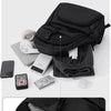Black multi-compartment storage backpack showing various items like a phone, glasses, and shoes.