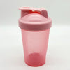 A pink leakproof protein shaker bottle with a hinged lid is shown against a white background.