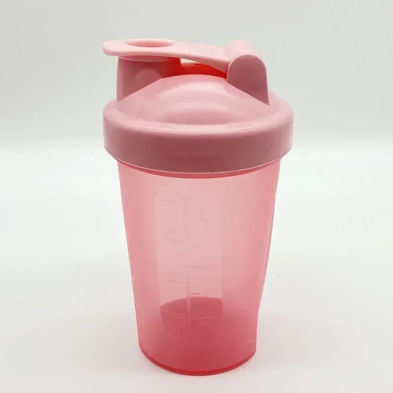 A pink leakproof protein shaker bottle with a hinged lid is shown against a white background.