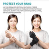 A woman is shown wearing black copper infused compression wrist support gloves on her hand.