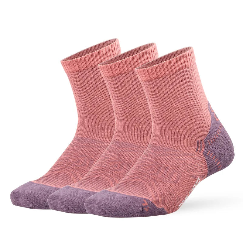 A set of three breathable performance running socks in shades of pink and purple.