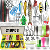 A variety of fishing lures including spoons, jigs, hooks, and baits are displayed in an open box.