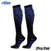 A pair of black compression socks with blue accents for sports.