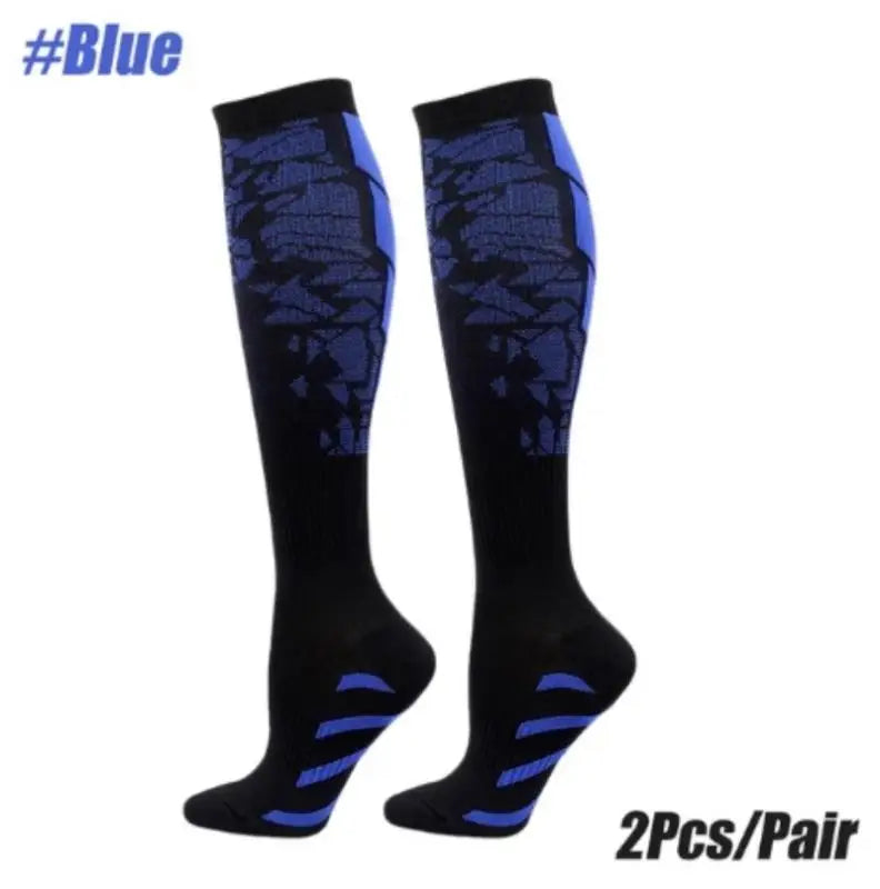 A pair of black compression socks with blue accents for sports.
