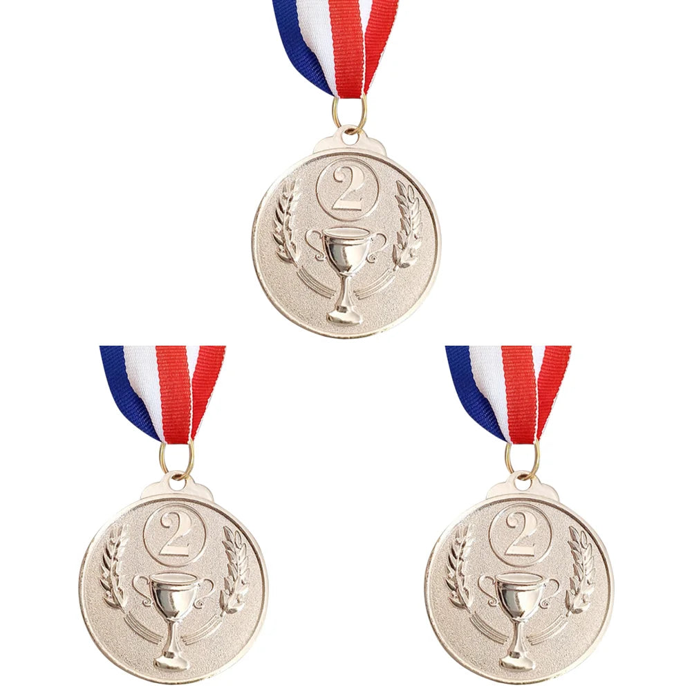 A set of three gold silver and bronze sports achievement medals hanging from ribbons.
