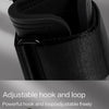 Close-up of black adjustable hook and loop strap used for wrist wraps or lifting gear.