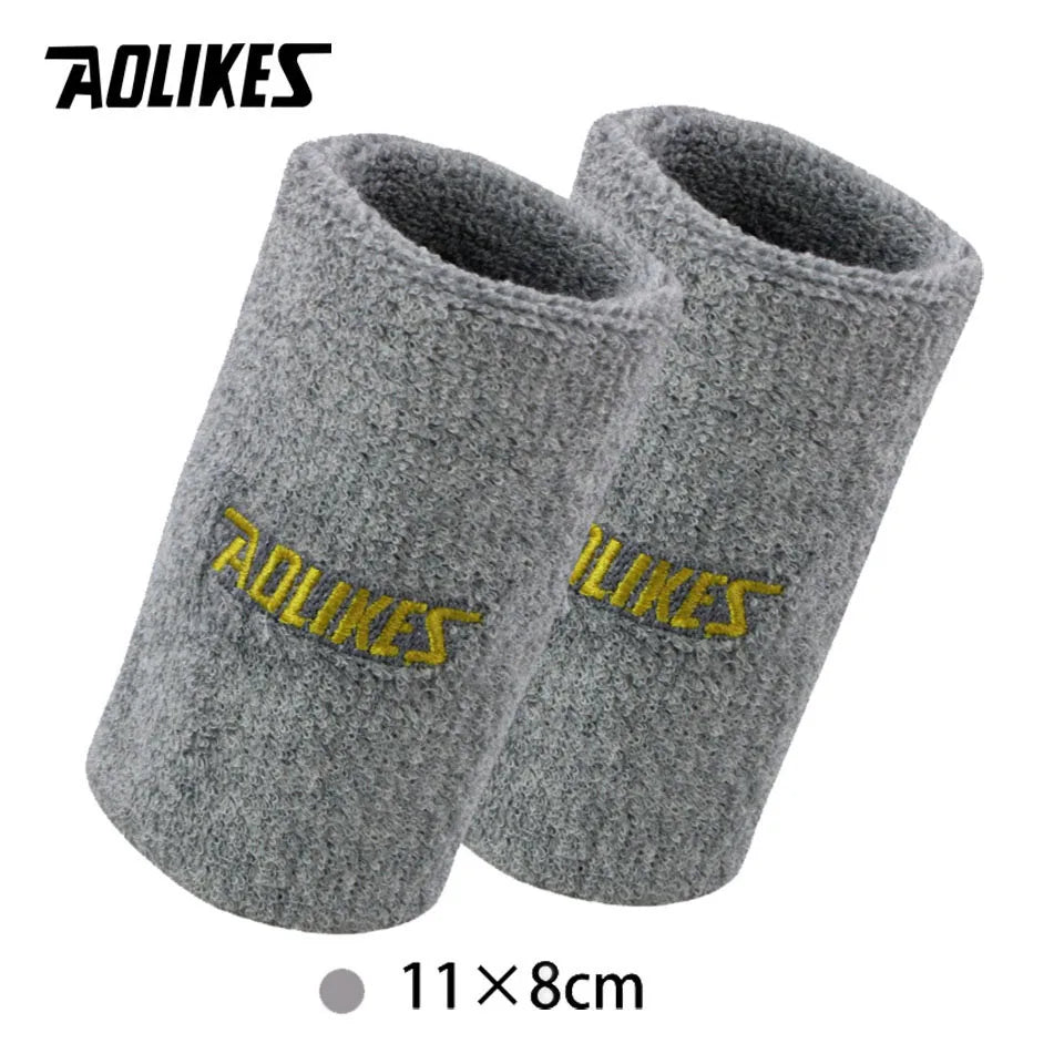 A pair of gray wool wristbands for sport or activewear