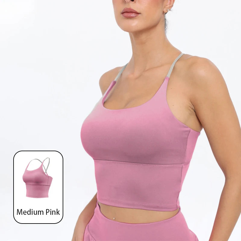 A model wearing a pink summer strappy yoga sports bra top.