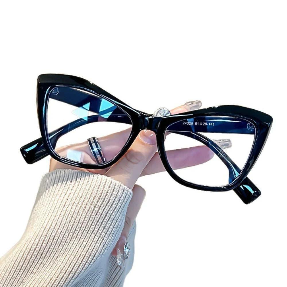 A pair of vintage color block blue light blocking eyewear is shown being worn by a person.