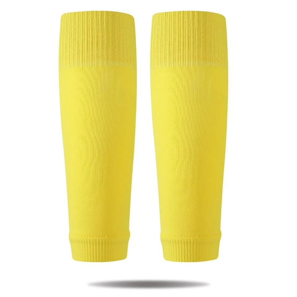 A pair of bright yellow professional compression soccer and sports sleeves.