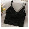 Black off-shoulder camisole tank top for women displayed on a light fabric.
