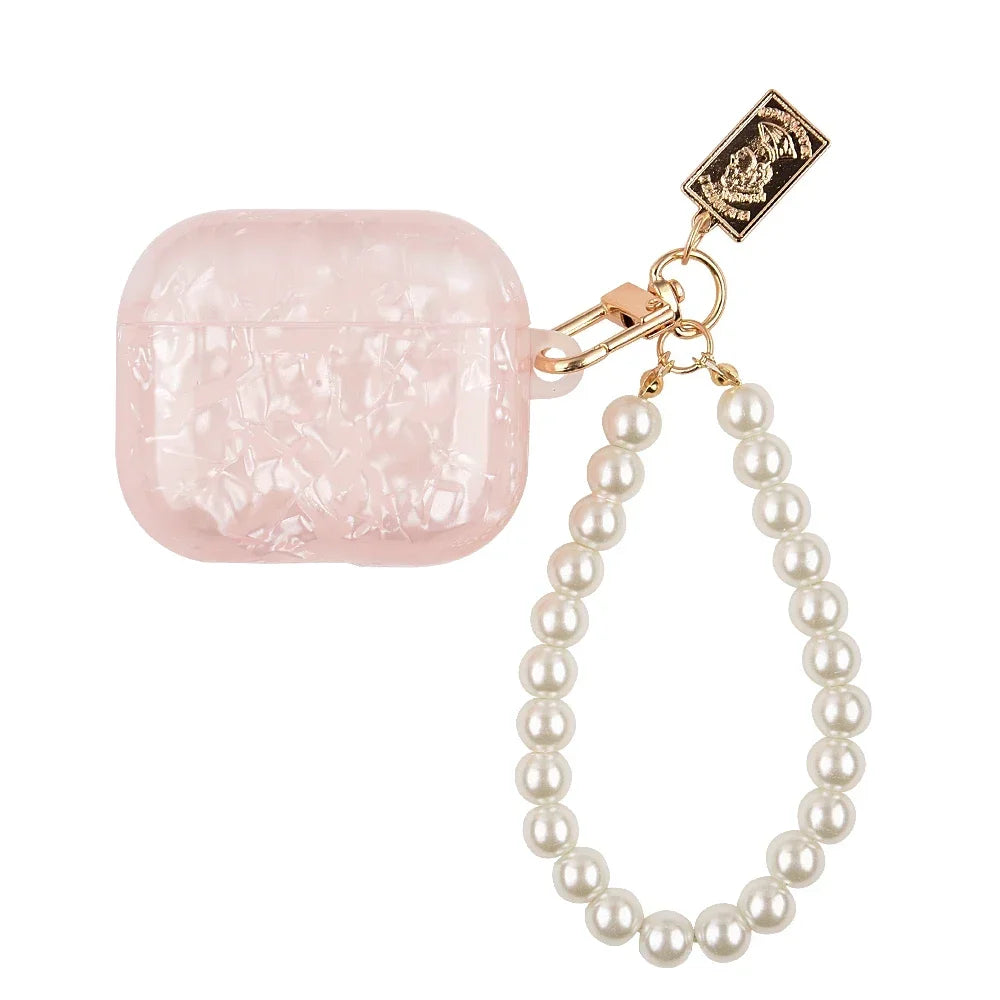 A pink leopard pearl protective case for AirPods Pro with a gold chain and charm.