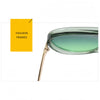 A pair of classic double-bridge aviator sunglasses with a gold-toned frame and green tinted lenses.