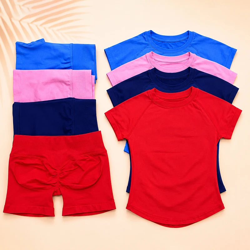 A colorful seamless high-waist yoga set for women featuring tops and shorts in blue, pink, purple, and red.