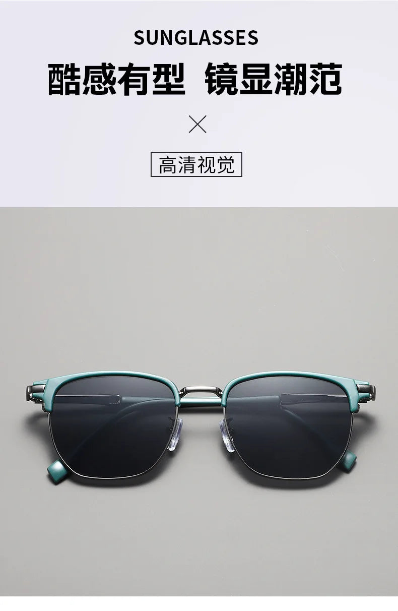 A pair of teal-framed sunglasses with dark lenses shown against a light gray background.