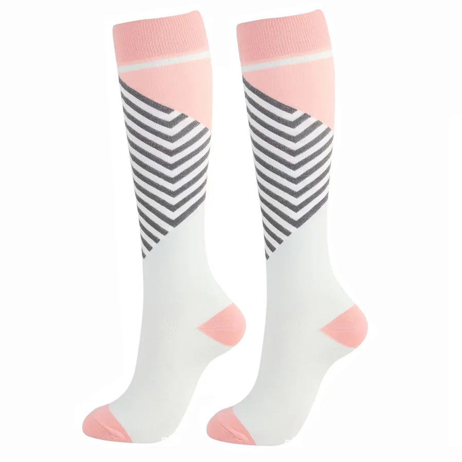 A pair of pink and white striped compression elastic socks for sports and daily wear