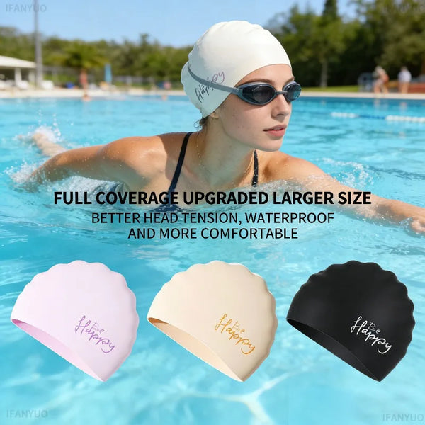 A woman wearing a white silicone swim cap is floating in blue water, with three colored caps displayed below.
