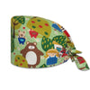A printed cotton surgical cap featuring cute animal characters on a green background.